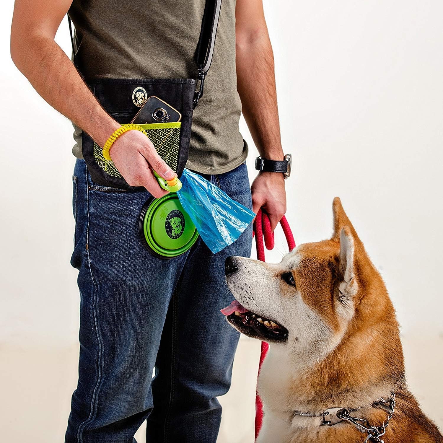 Dog Training and Walking Treat Pouch with Poop Bag Dispenser, Pro Clicker, Collapsible Travel Bowl, and Reflective Shoulder Strap - Black/Green